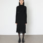 Model wears Issue Twelve Nina Rib Jumper in Black Wool