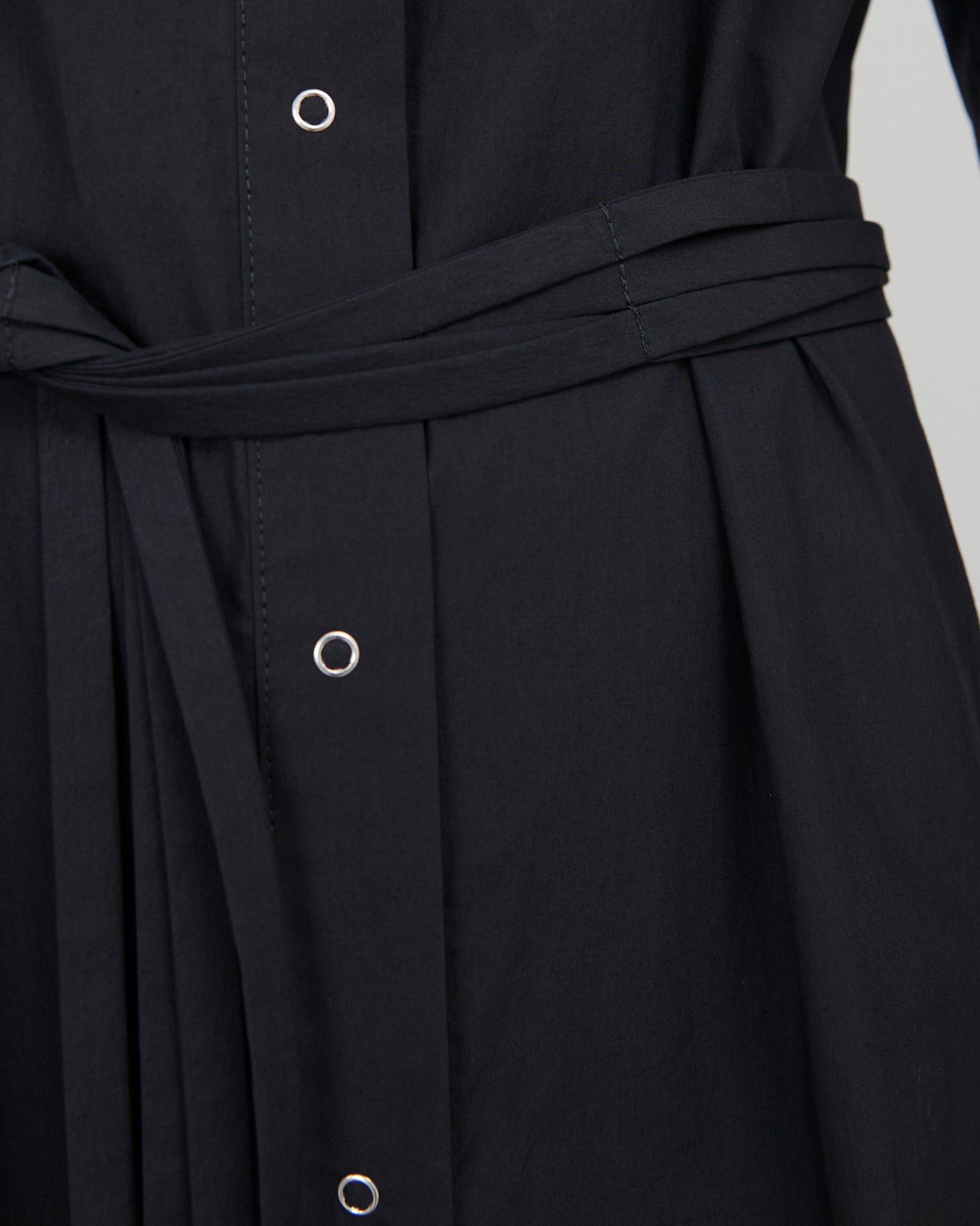 Detail of the silver buttons on the Issue Twelve Joan Dress in black cotton