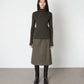 Model wears Issue Twelve Nina Jumper in Wool Green