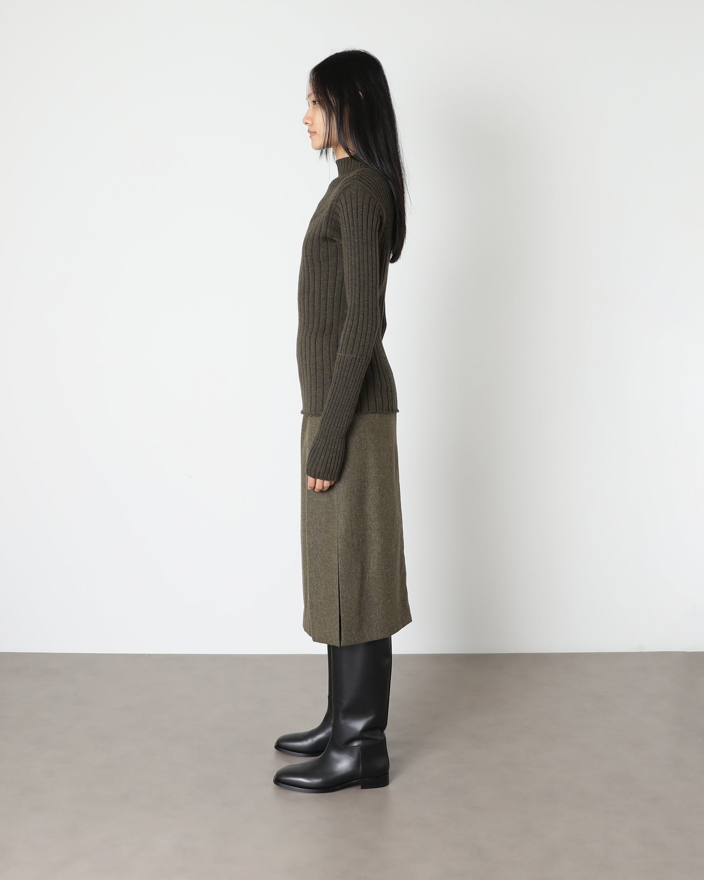 Model wears Issue Twelve Nina Jumper in Wool Green