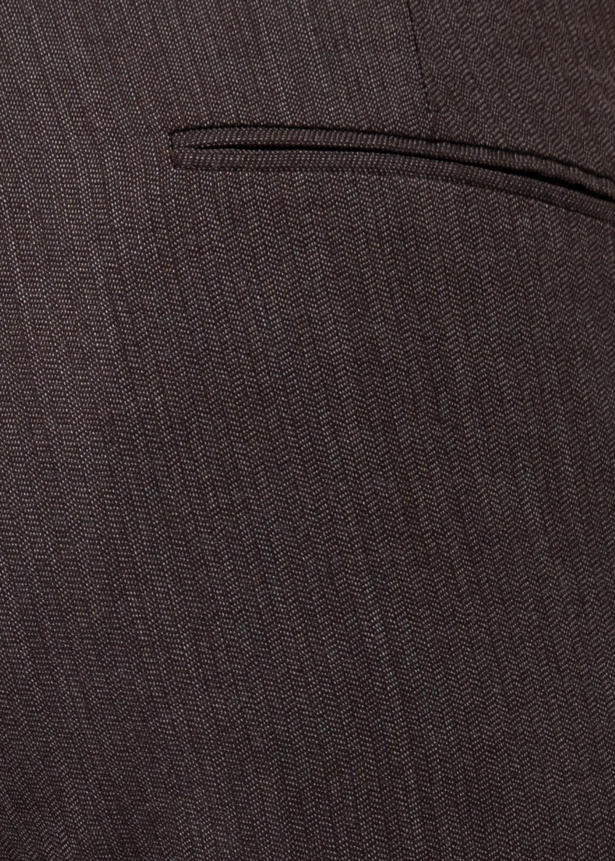 Fabric and pocket detail of Issue Twelve wool herringbone straight leg trouser in grey brown